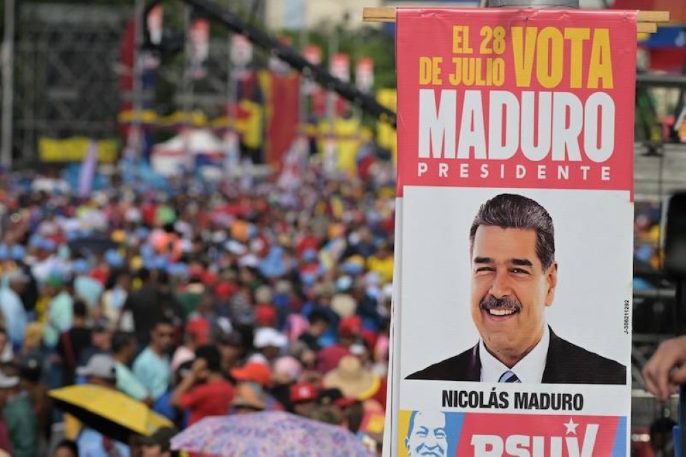 Simpatizantes del gobernante venezolano, Nicolás Maduro, durante su cierre de campaña en Caracas este jueves./AFP 