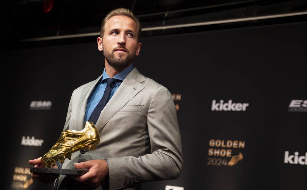 Harry Kane con la Bota de Oro. Anotó 36 goles en la Bundesliga. ,image_description: