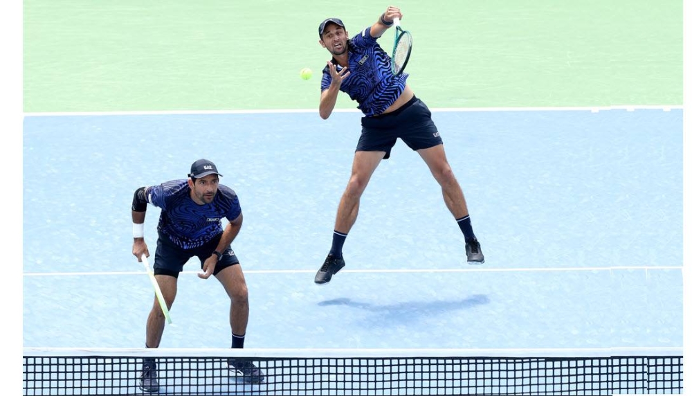 Chelo Arévalo y Mate Pavic en acción en el US Open. / AFP,image_description: