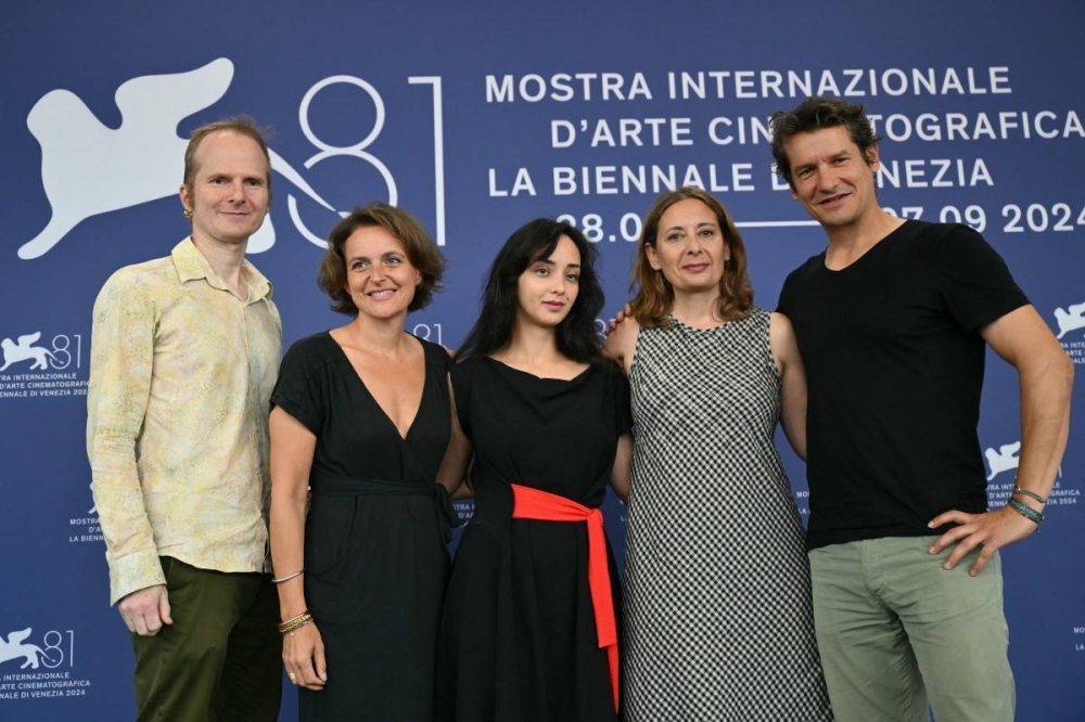 La joven directora Anastasia Trofimova centro recientemente presentó el documental Russians at War en el Festival de Venecia. Photo by Alberto PIZZOLI / AFP,image_description: