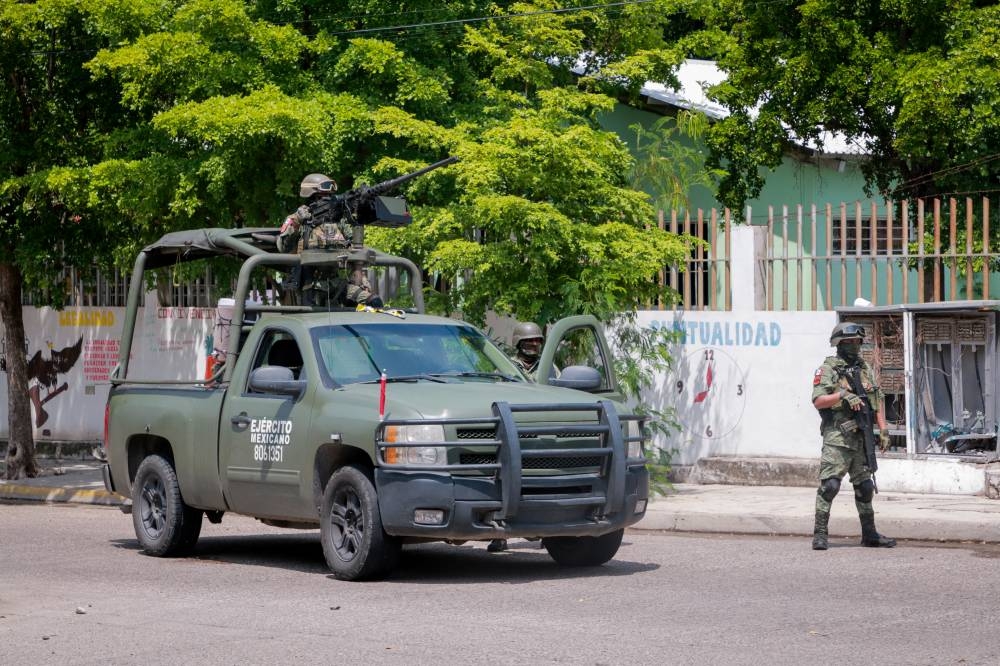 La creciente violencia criminal, en gran parte relacionada con el narcotráfico y las pandillas, ha provocado el asesinato de más de 450.000 personas en México desde 2006/ Foto Iván Medina AFP.,image_description: