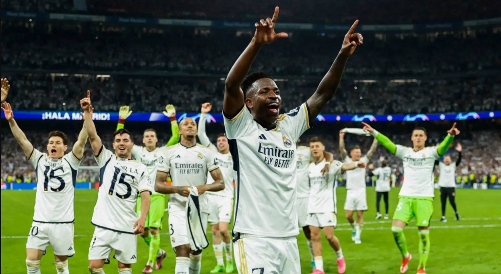 Vinicius durante la celebración del Real Madrid en la última Champions. / AFP,image_description: