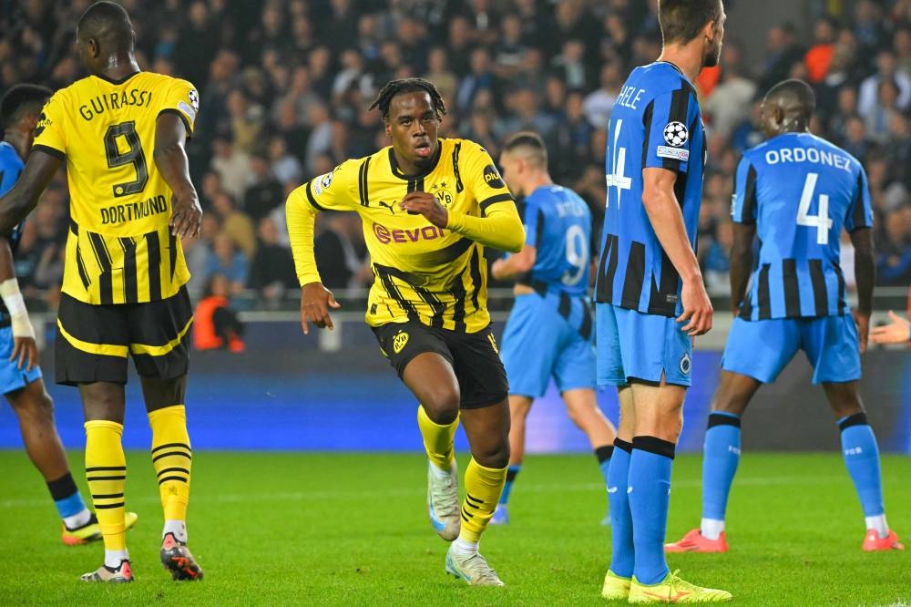 Jamie BynoeGittens celebrata uno de los goles ante Brujas. / AFP,image_description: