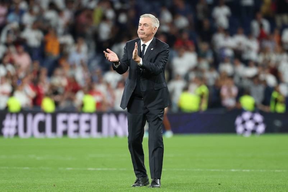 El entrenador del Real Madrid, Carlo Ancelotti celebrando los triunfos de su equipo./AFP ,image_description: