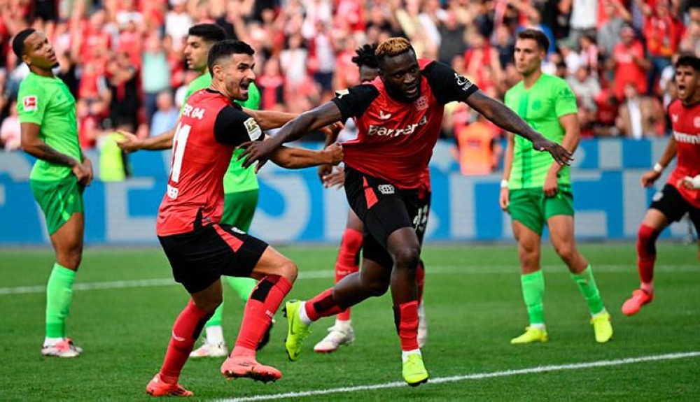 El delantero nigeriano, Victor Boniface, celebra tras anotar el tanto de la victoria del Leverkusen. / AFP,image_description: