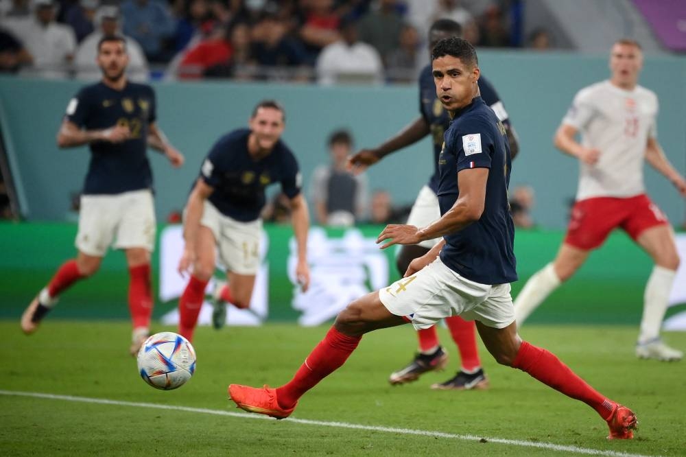 Raphael Varane y su último Mundial: Qatar 2022 frente a Polonia. / AFP,image_description: