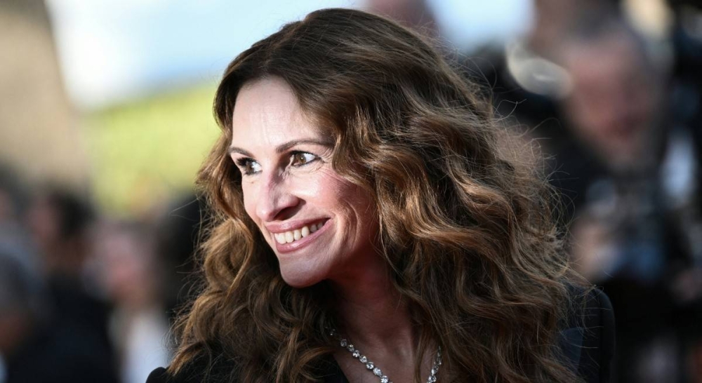 Julia Roberts, próxima a los 57 años de edad, ha dejado una imborrable huella en el cine gracias a su talento y carisma. Photo by LOIC VENANCE / AFP,image_description: