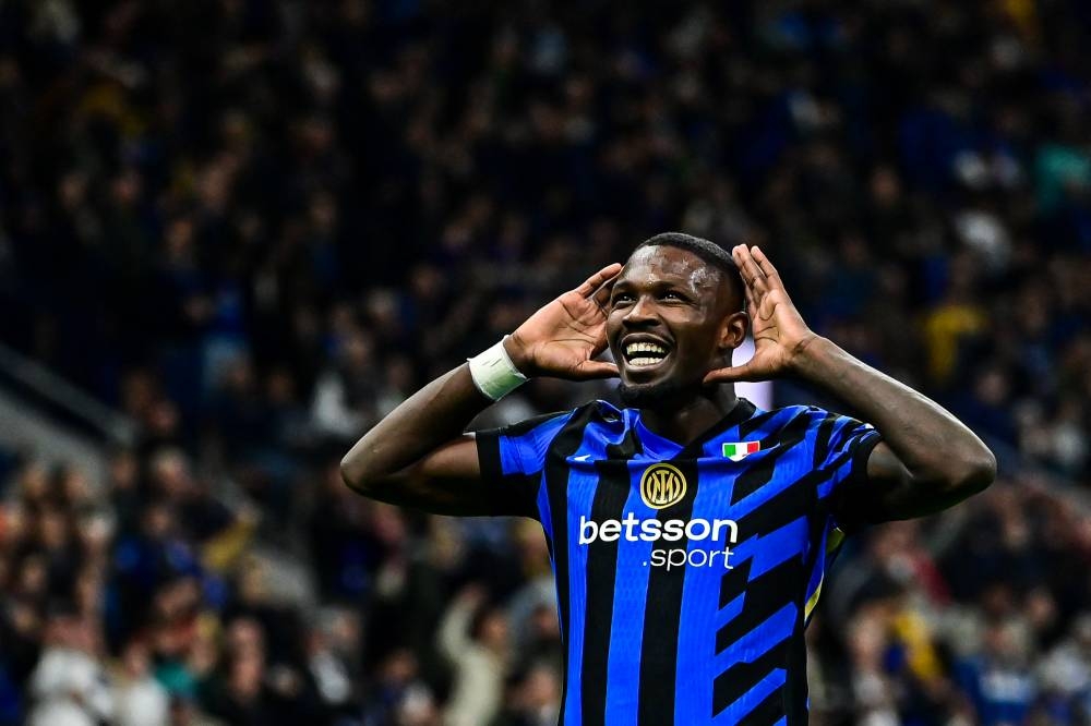 Marcus Thuram celebra uno de sus tres goles al Torino. / AFP,image_description: