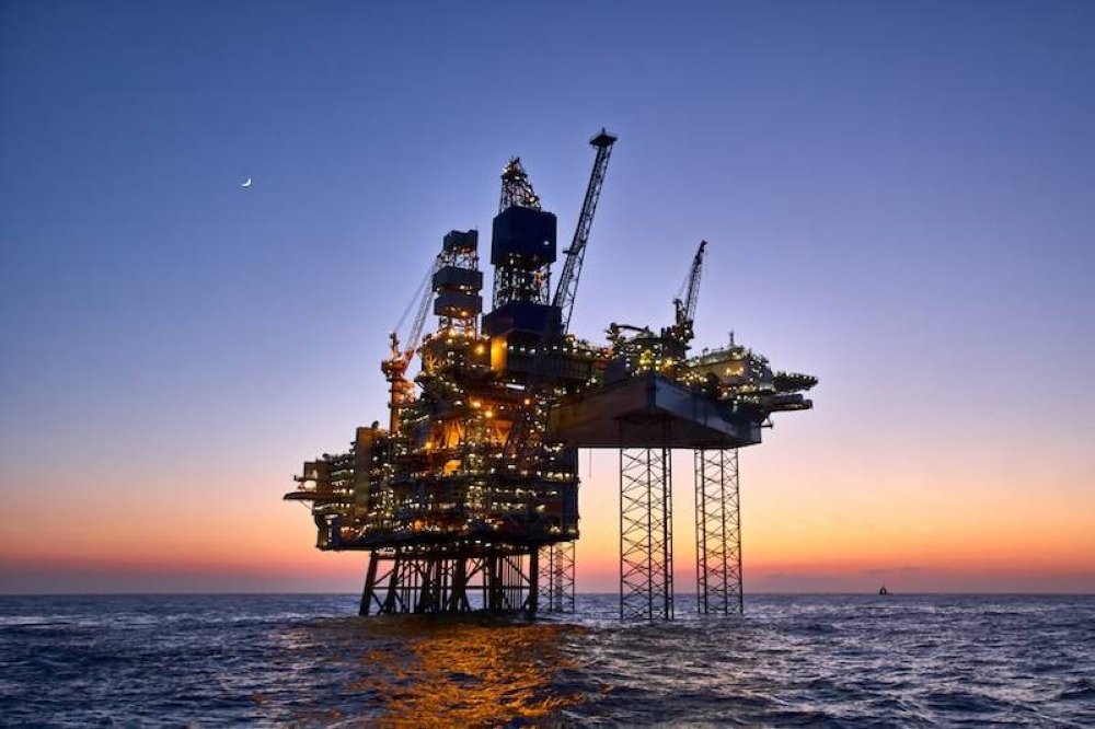 ,image_description:Offshore oil and gas platform on production site. nJack up rig crude oil production in the North Sea.