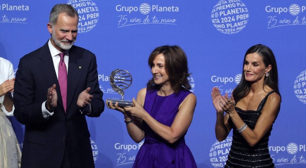 Paloma Sánchez Garnica recibió el galardón de manos de los reyes de España, Felipe VI y Letizia. Photo by LLUIS GENE / AFP,image_description: