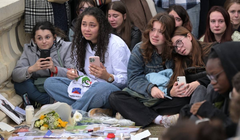 Fans del cantante británico rindieron honor en París. Photo by Bertrand GUAY / AFP,image_description: