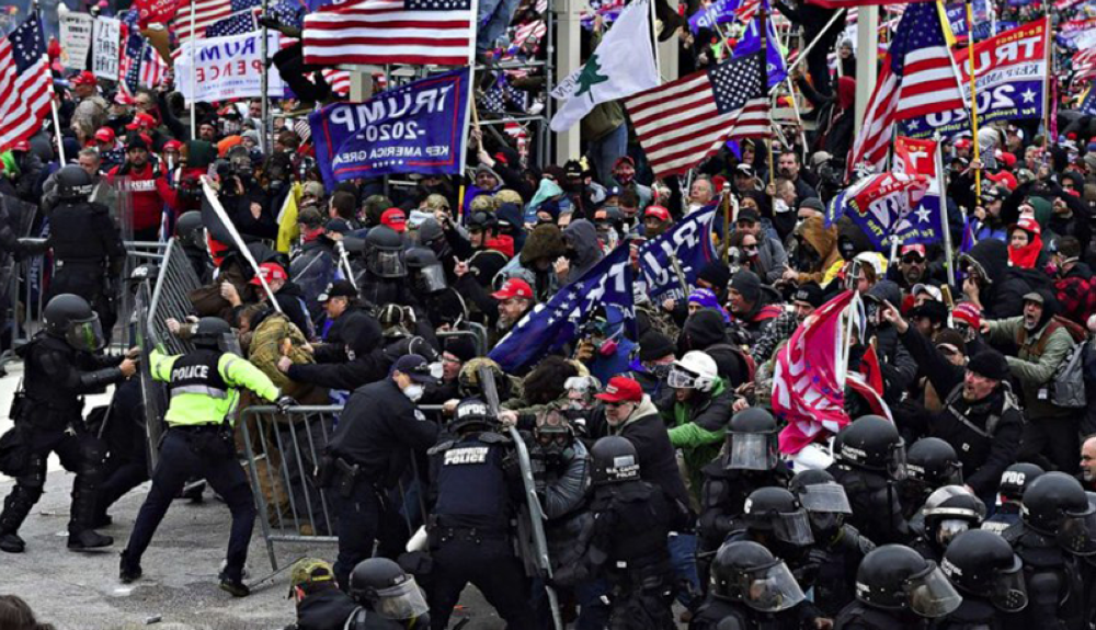 La derrota electoral de Trump en el 2020 causó revuelo entre sus simpatizantes ocasionando el asalto al capitolio. / AFP.,image_description: