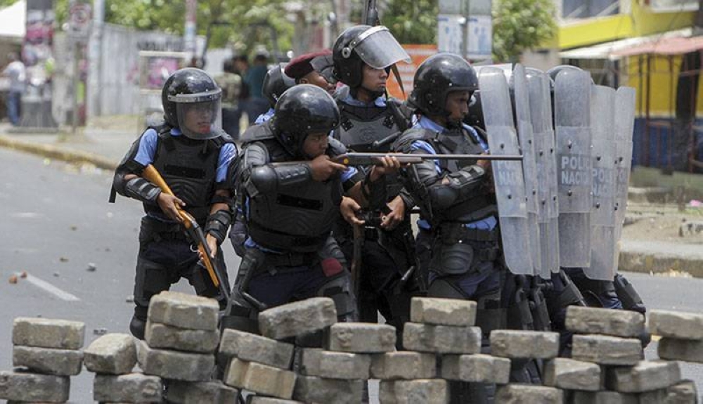 Imagen de archivo de la represión gubernamental contra las protestas en Nicaragua en 2018./AFP,image_description: