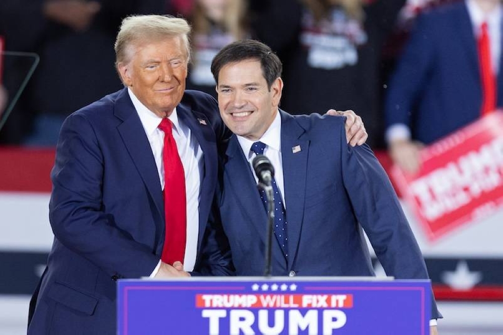 Marco Rubio junto al presidente electo Donald Trump, quien lo designó Secretario de Estado, durante un acto de campaña el 4 de noviembre en Carolina del Norte./AFP,image_description: