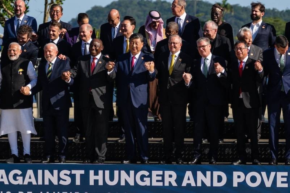 Líderes del G20 posan para una foto grupal en la cumbre que se celebra en Rio de Janeiro, Brasil. / AFP,image_description: