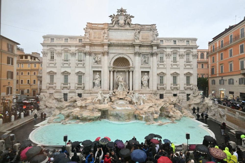 A general view shows the Trevi fountain after renovation works in Rome, on the day of its reopening, on December 22, 2024. (Photo by Alberto PIZZOLI / AFP)