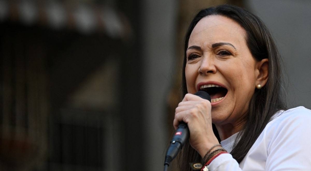 María Corina Machado, opositora venezolana en el discurso de este jueves antes de su detención/ Foto cortesía AFP.,image_description: